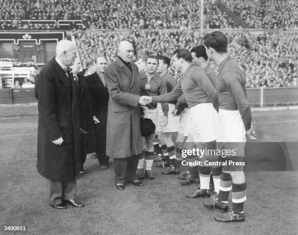 The Earl of Athlone shaking hands with the Hungarian football team, before their match against England at Wembley stadium.