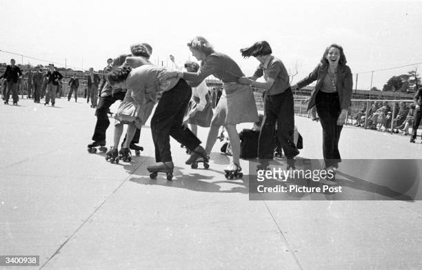 Group of holidaymakers, in the Butlin's Camp at the North Yorkshire seaside resort of Filey, learning to rollerskate. Original Publication: Picture...