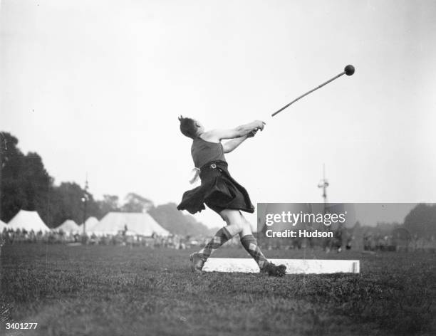 Highland Games in London, D Smith throwing the hammer.