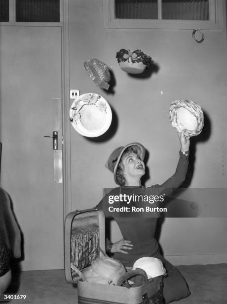French star Line Renaud in London with her new collection of hats. She is to appear as resident hostess for the Associated Television programme...