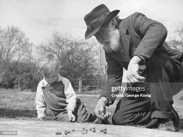 Year old Sam Spooner receives a sound thrashing from young Tony Westbrook, who will walk off with all the oldster's marbles.