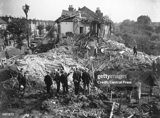 Damaged buildings on the outskirts of London, caused by a single heavy bomb during the Blitz.