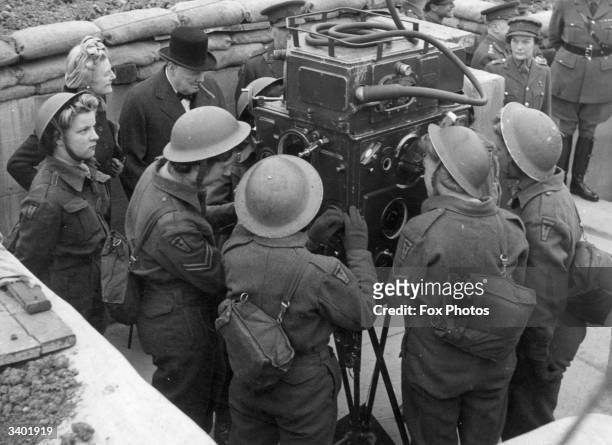 Prime Minister Winston Churchill , and Mrs Clementine Churchill , visiting a 'mixed' AA battery where members of the Auxiliary Territorial Services ,...