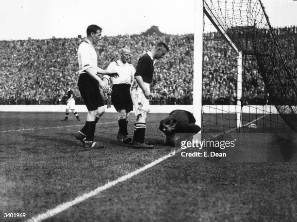 Liverpool goalkeeper Hobson gathers the ball safely at the feet of Charlton's frustrated inside right, Prior, as Charlton Athletic play Liverpool at...