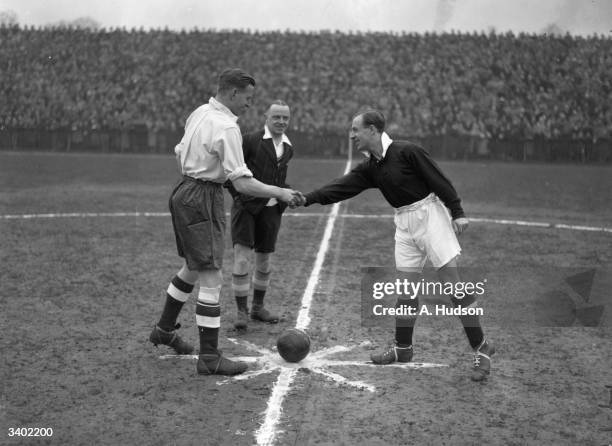 The captains shake hands before the kick-off as England and Scotland amateur international teams play at Dulwich Hamlet's Champion Hill ground. They...