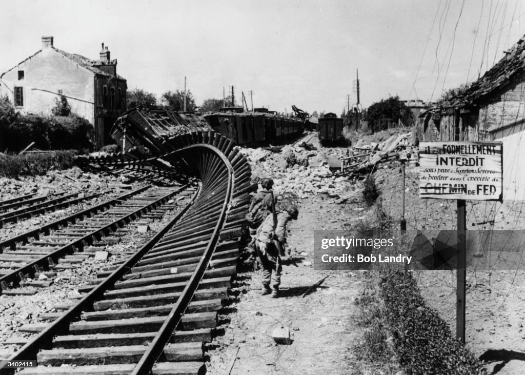 Twisted Rails Blasted and twisted railway tracks at Carentan after the town was ...