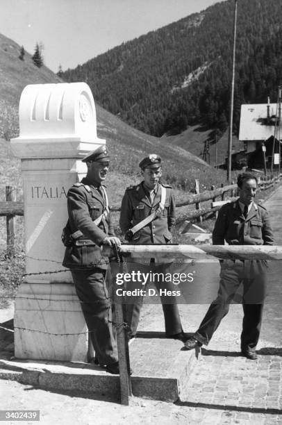 Italian soldiers guarding the barrier at Brenner Pass, the Austrian-Italian border.