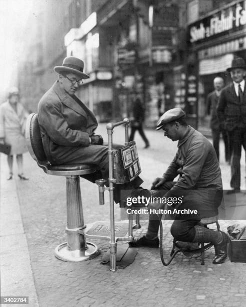 An automated bootblack machine, in use on the streets of Berlin.