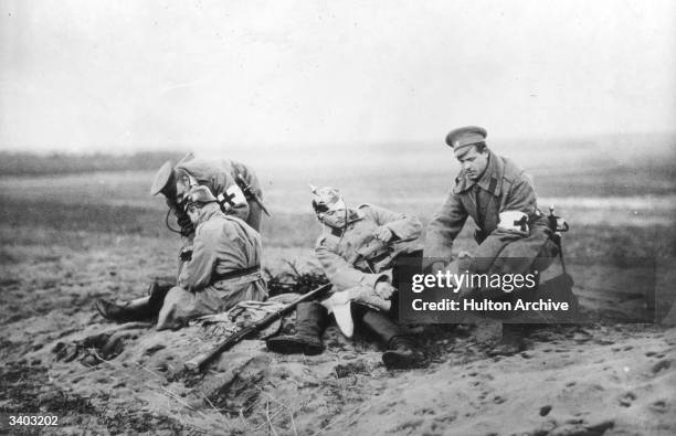 Red Cross personnel attending to wounded soldiers on a Russian battlefield during the First World War.