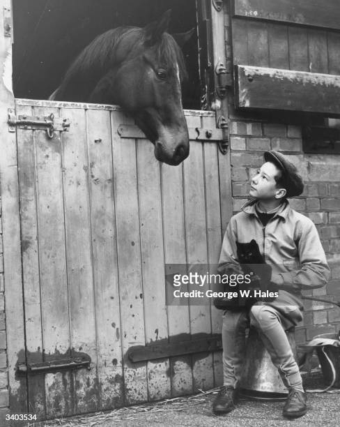 Apprentice jockey Lester Keith Piggott at his father's training stable at Lambourn. 1950's most successful apprentice jockey; Piggott rode his first...