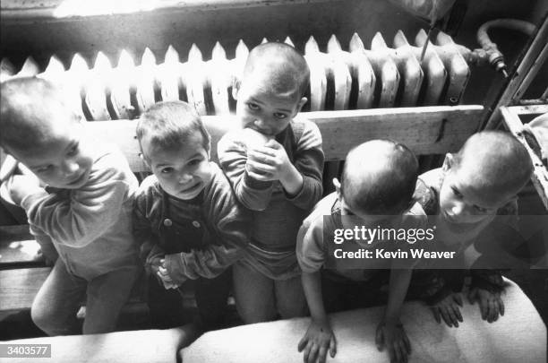 Romanian orphans in a Bucharest orphanage shortly after the December Revolution in 1989.