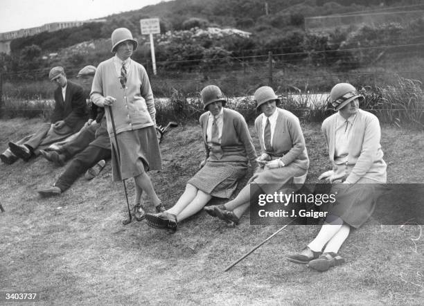 Team competing in the Ladies Foursomes at Turnberry in Ayrshire having a rest on the green between shots. Left to right - F G Neilson, J McCulloch,...