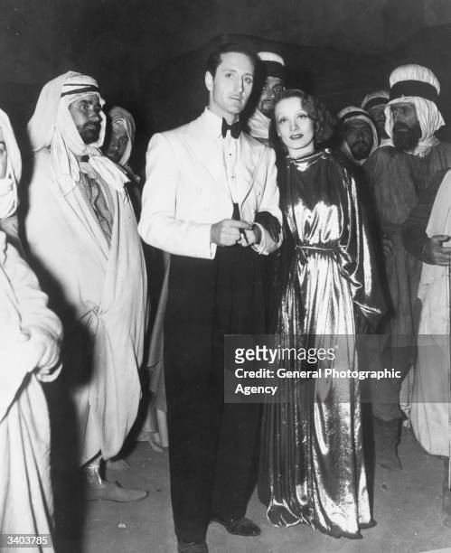Marlene Dietrich and Basil Rathbone star in the David O Selznick film 'The Garden Of Allah', set in the Algerian desert.