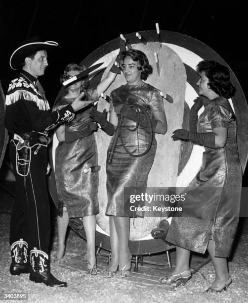 Prieto the knife thrower training with his assistants the Ping-Pongs in preparation for their gala performance at Berlin's Circus Althoff.