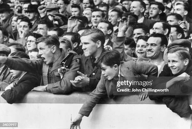 Excited fans at Ibrox in Glasgow, watching the football match between Glasgow Rangers and Celtic. Large crowds always gather for the 'Old Firm'...