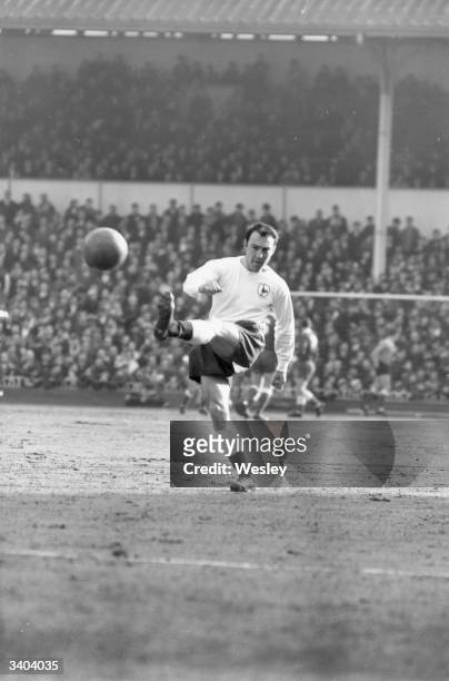 Tottenham Hotspur's Jimmy Greaves has a shot at the Fulham goal in a match at White Hart Lane which Spurs eventually won 4-3.