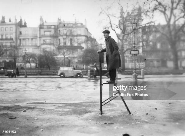 An orator waiting for a crowd to gather at Speaker's Corner in London's Hyde Park.