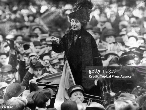 British suffragette Emmeline Pankhurst , being jeered by a crowd in New York.