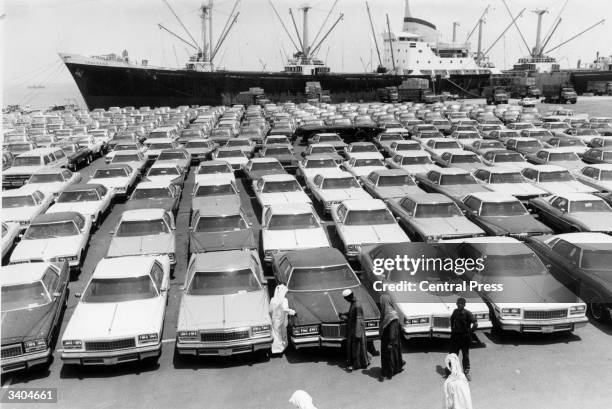 Consignment of cars from the USA lined up on the dockside at Dammam awaiting collection by their new owners.