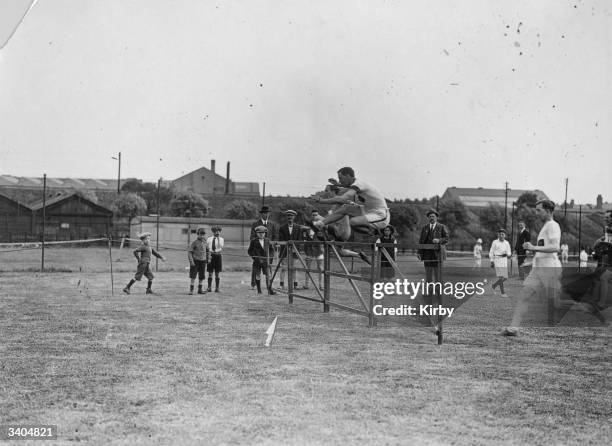 Hurdle race in progress during the Midland Railway Sports Day at Cricklewood.