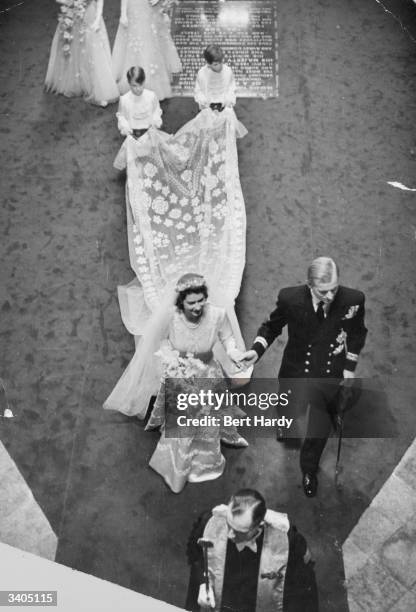 Queen Elizabeth II with Prince Philip, Duke of Edinburgh, on their wedding day in Westminster Abbey, London. Original Publication: Picture Post -...