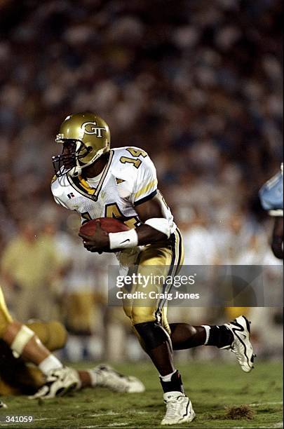 Quarterback Joe Hamilton of the Georgia Tech Yellow Jackets runs with the ball during a game against the North Carolina Tar Heels at the Kenan...