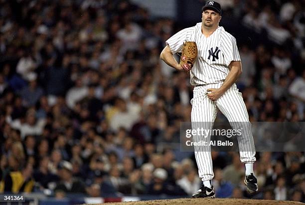 Pitcher David Wells of the New York Yankees grabs his crotch during game one of the American League Divisional Series against the Texas Rangers at...