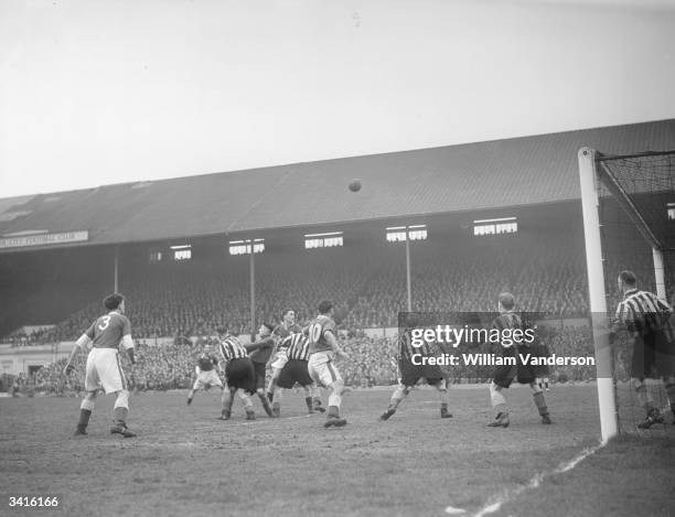 Leicester City's forwards compete for an aerial ball with Grimsby Town's defence during a match at Leicester's Filbert Street ground. Original...