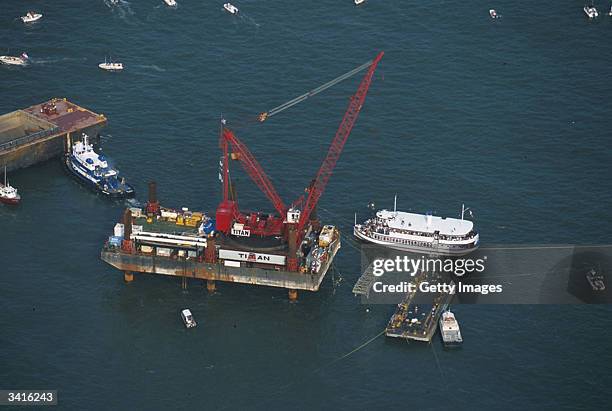 This image, provided by Friends of the Hunley, shows an aerial view of the Titan crane on the Karlissa B lifting the Hunley out of the water. After...