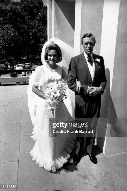 Camilla Shand arrives at the Guard's Chapel for her wedding to Andrew Parker-Bowles, on the arm of her father Major Bruce Shand.