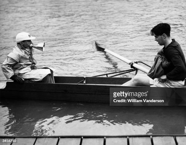 Massey, the 3ft 11inch tall cox of the Oxford University rowing crew, shouts orders to his team mates during training for the annual Oxford and...