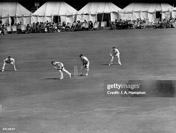 English cricketer Denis Compton batting during a cricket match between Middlesex and Kent at Canterbury.