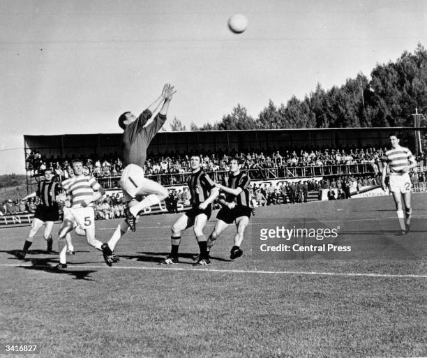 Celtic's goalkeeper, Ronnie Simpson, jumps to catch a high ball from Inter Milan during the European Cup final in Lisbon. Tommy Gemmell and Stevie...