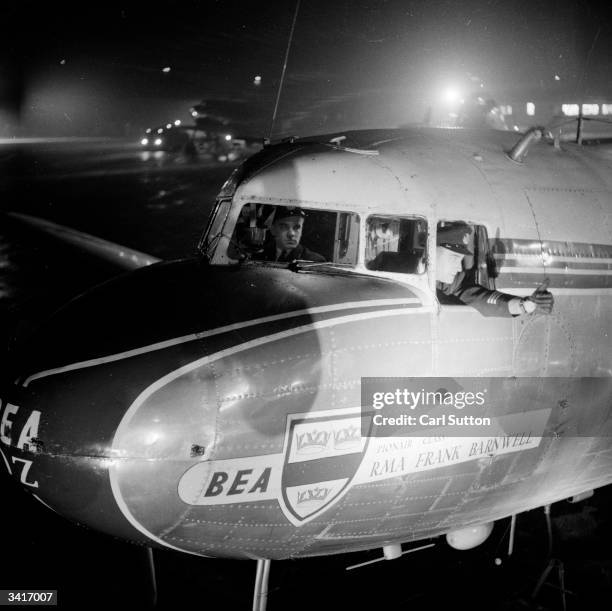 Pilots prepare to fly overnight mail from Manchester's Ringway Airport to Ireland. Original Publication: Picture Post - 6843 - Picture Post TV...