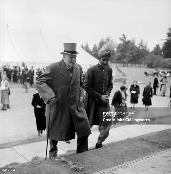 British Prime Minister, Winston Churchill with the Sultan of Kelantan, Malaysia, at a garden party at Blenheim Palace in Oxfordshire, to celebrate...