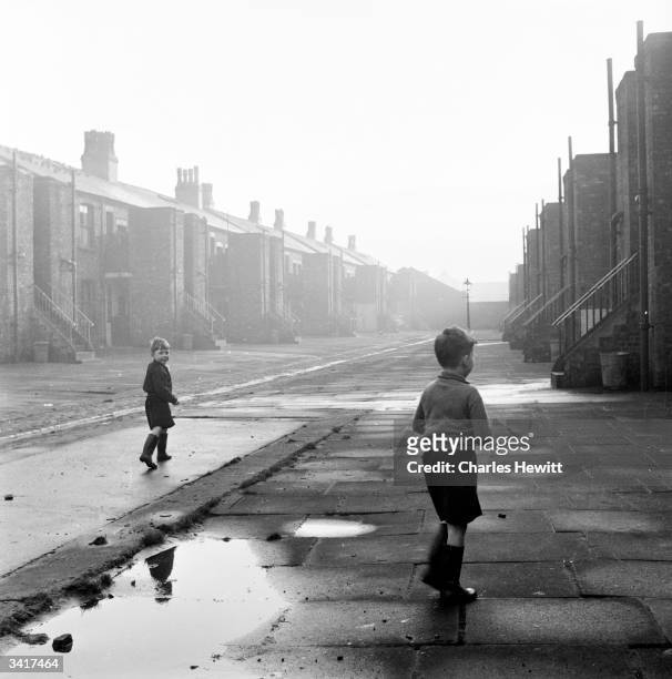 Young boys playing on a quiet backstreet in Manchester. Original Publication: Picture Post - 6871 - The Best And Worst Of Our Cities : Manchester -...