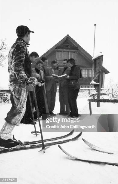 Residents of the Swiss village of Pestalozzi talk with the crew of the film 'The Village' by the Swiss Praesena Film company, which documents the...