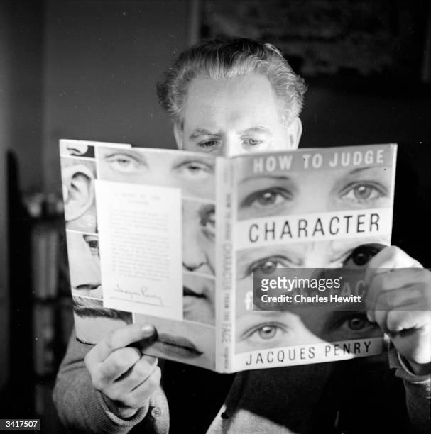 Canadian writer Jacques Penry reading his book 'How To Judge Character From The Face'. Original Publication: Picture Post - 6866 - Let's Make Faces -...