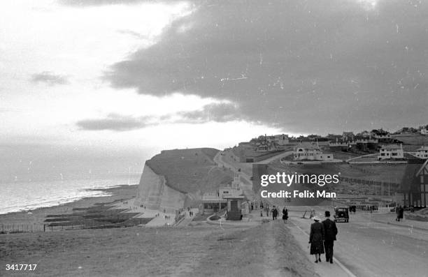 Sunset stroll at Brighton from Black Rock to Saltdean, a new estate on the cliffs. Part of the Undercliff walk, a favourite for holidaymakers....