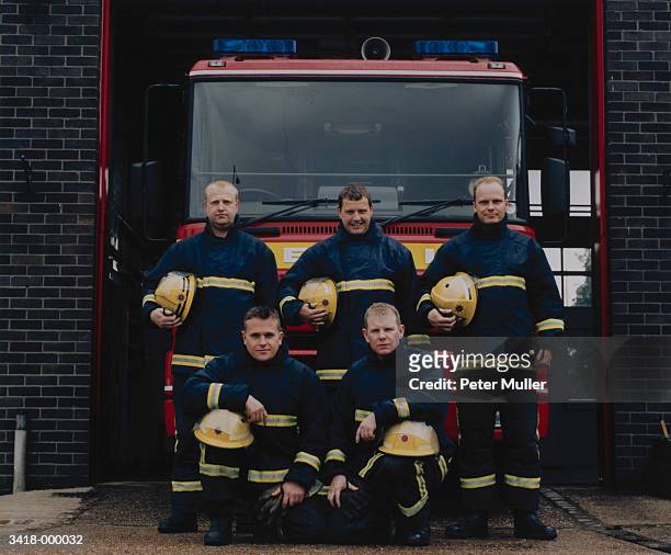 group of firefighters - fireman uk stock pictures, royalty-free photos & images