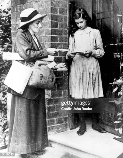 Post woman delivering post.