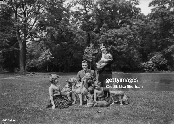 The Royal Princesses Margaret and Elizabeth with their mother, Elizabeth Bowes-Lyon and their father Albert, Duke of York with their dogs, including...