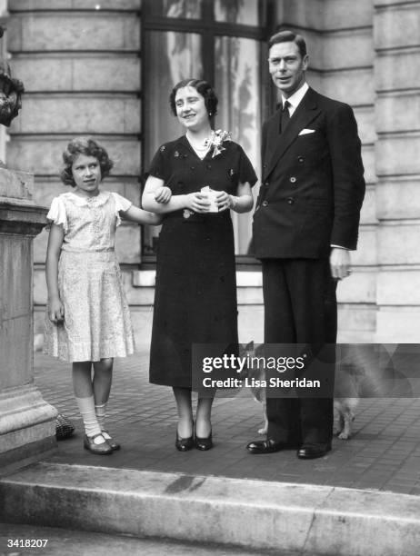 George, Duke of York and Elizabeth, Duchess of York with their daughter Princess Elizabeth on the terrace at 145 Piccadilly, London, their home...