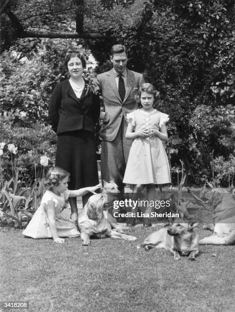 The Royal family with their dogs in the grounds of the Royal Lodge, Windsor Queen Elizabeth, Queen Consort to King George VI, King George VI,...