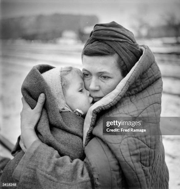 Mother clutching her child in Berlin after surviving a 'Death March' from Lodz which they embarked upon in the hope of finding food and shelter in...