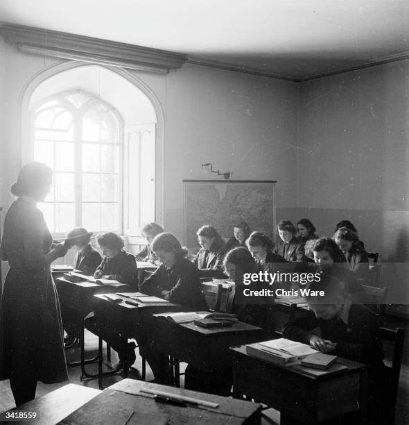 Pupils of Craigmount School in a classroom at Scone Palace in Perthshire . The school moved here from Edinburgh in 1939. The Stone of Destiny, also...