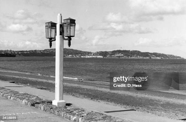 Street lamp by the promenade at Paignton beach, Devon.