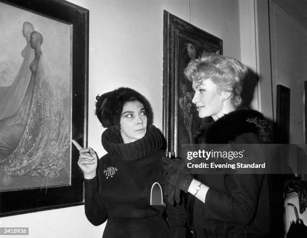 Italian Surrealist artist Leonor Fini and Danica d'Hont at the Kaplan Galleries.