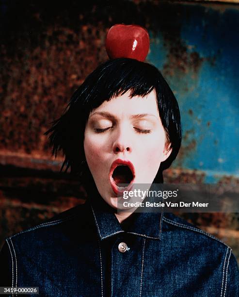 woman with an apple on head - women open mouth stock pictures, royalty-free photos & images