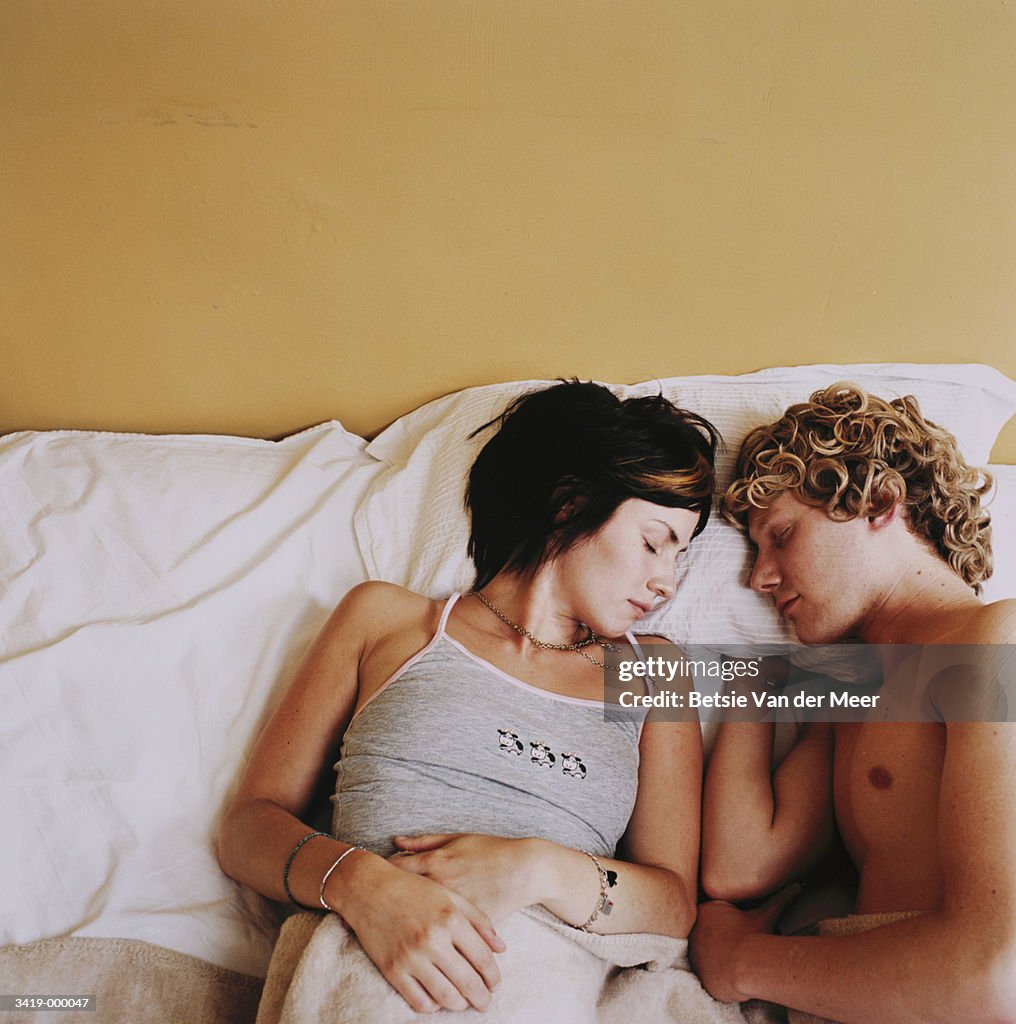 Couple Sleeping in Bed